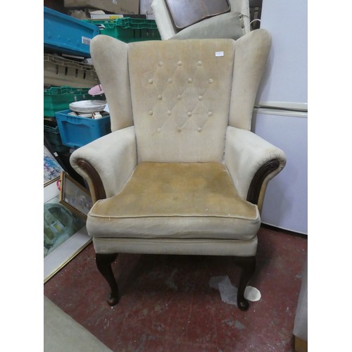 1129 - An Stunning Upholstered winged backed Armchair.