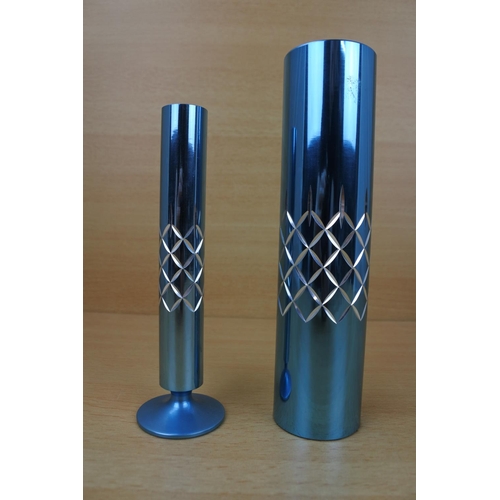 1131 - Two vintage metal diamond cut vases.