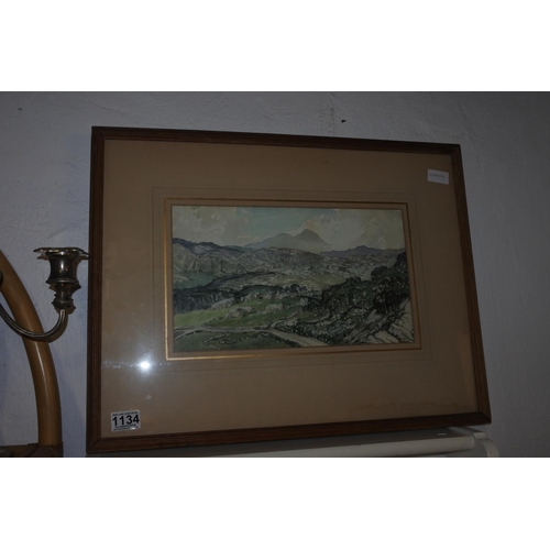 1134 - A framed watercolour of a mountain scene, unsigned, Approx 60x47cm.