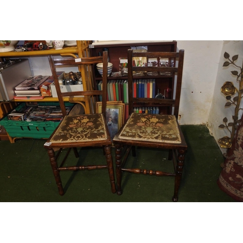 1138 - A pair of antique oak framed bedroom chairs.