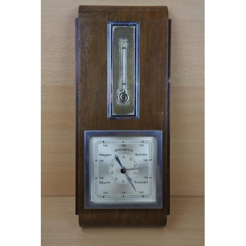 1151 - An unusual vintage framed barometer in German.