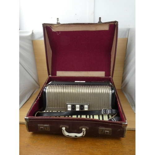 516 - A vintage cased Honner accordion.