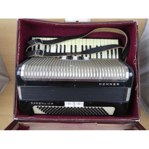 516 - A vintage cased Honner accordion.