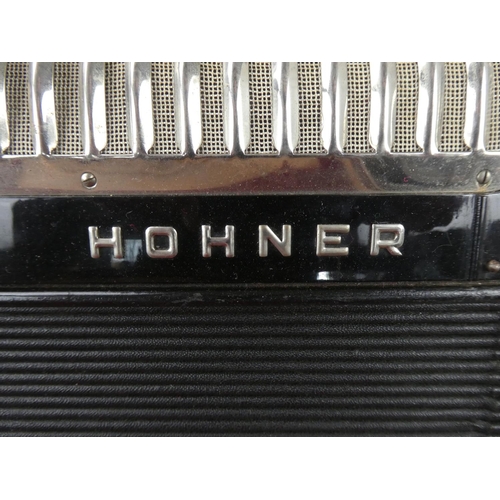 516 - A vintage cased Honner accordion.