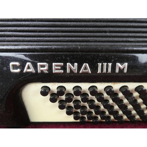 516 - A vintage cased Honner accordion.