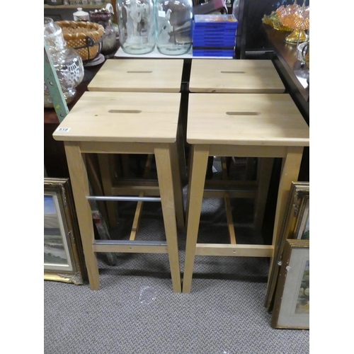 518 - A set of four pine stools.