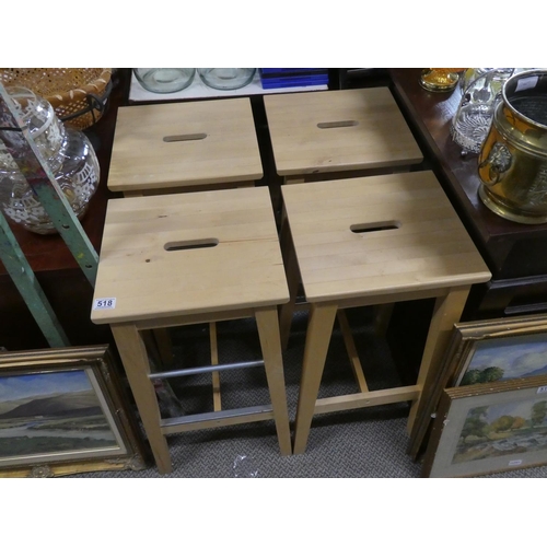 518 - A set of four pine stools.