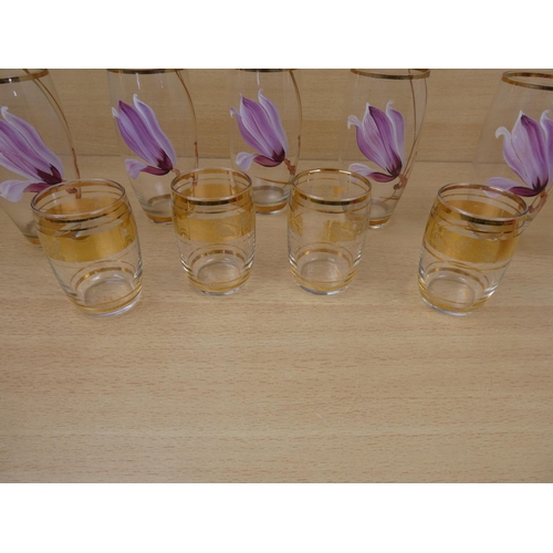 522 - An antique ruby glass bowl and jug and two sets of vintage glasses.