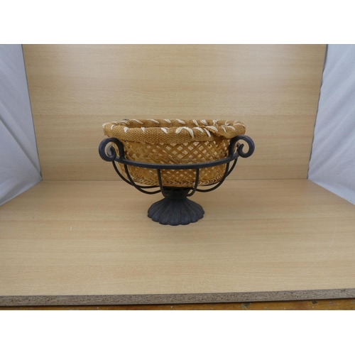 523 - A metal fruit basket and a rattan basket.