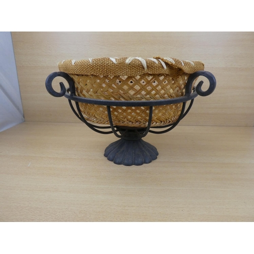 523 - A metal fruit basket and a rattan basket.