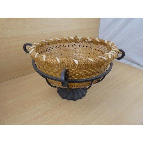 523 - A metal fruit basket and a rattan basket.