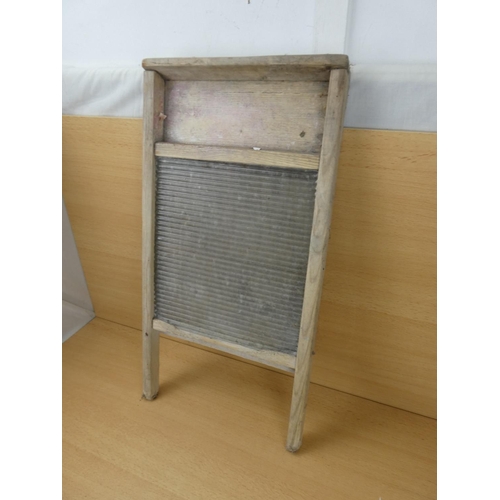 528 - A vintage glass washboard.