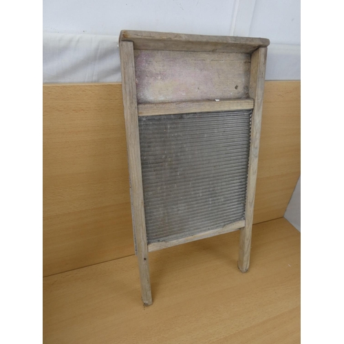 528 - A vintage glass washboard.