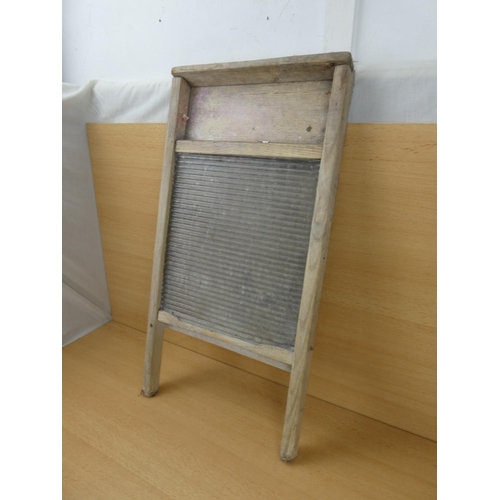 528 - A vintage glass washboard.