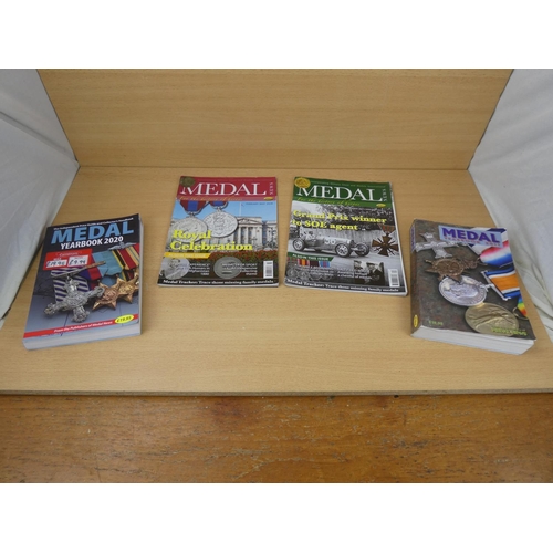 531 - Two Medal Yearbooks dated 2011 and 2020 and two similar magazines.