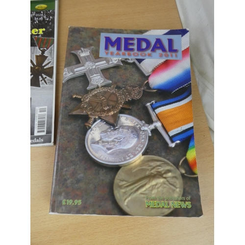 531 - Two Medal Yearbooks dated 2011 and 2020 and two similar magazines.