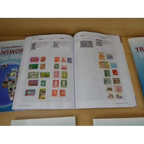 533 - Five Stanley Gibbons 'Transworld Stamp Albums' and contents.