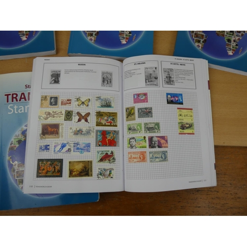 534 - Five Stanley Gibbons 'Transworld Stamp Albums' and contents.