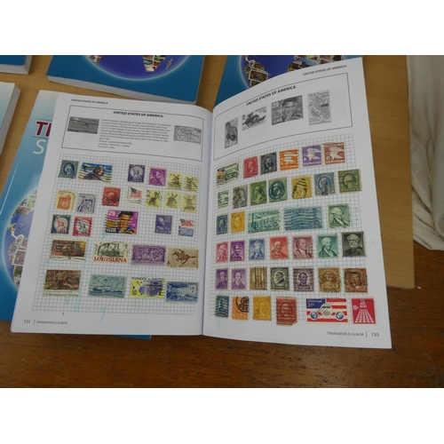 535 - Five Stanley Gibbons 'Transworld Stamp Albums' and contents.