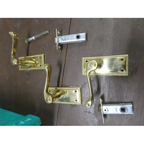 541 - A lot of brass door handles, locks etc.