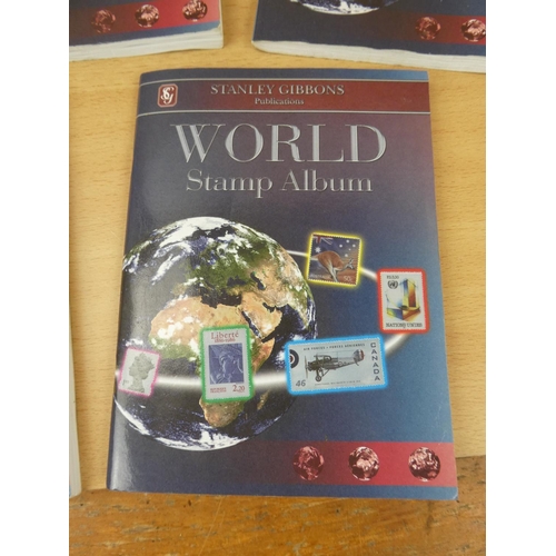 543 - A set of five Stanley Gibbons 'World' stamp albums and contents.