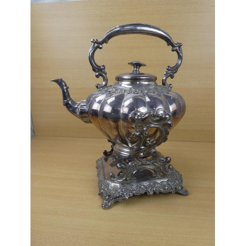 545 - A stunning silver plated spirit kettle and stand, measuring 37cm in height.