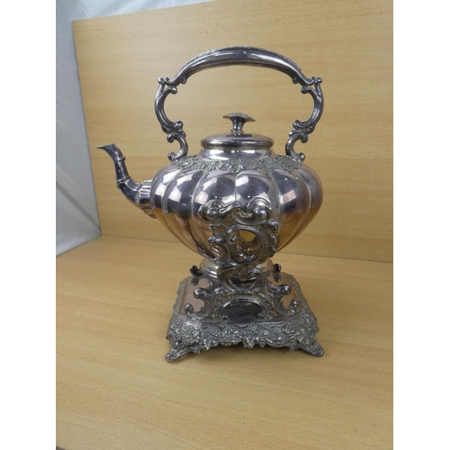 545 - A stunning silver plated spirit kettle and stand, measuring 37cm in height.