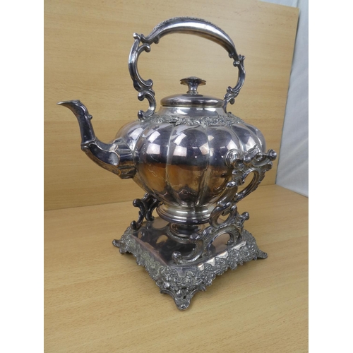 545 - A stunning silver plated spirit kettle and stand, measuring 37cm in height.