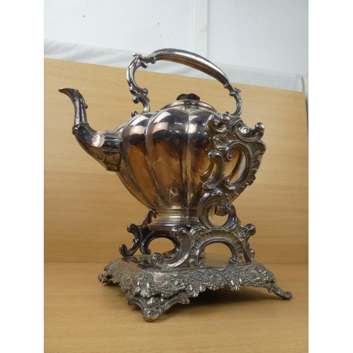 545 - A stunning silver plated spirit kettle and stand, measuring 37cm in height.