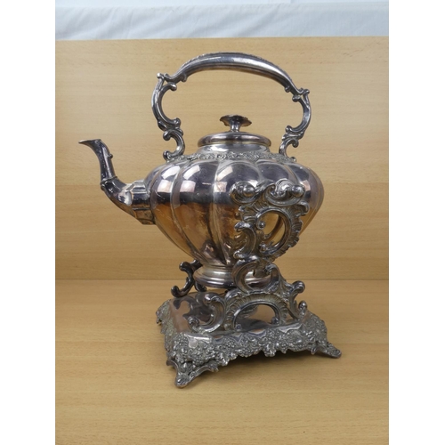 545 - A stunning silver plated spirit kettle and stand, measuring 37cm in height.