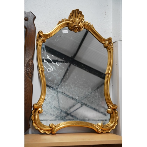 618 - A gilt framed wall mirror, measuring 54x90cm.