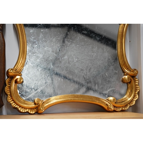 618 - A gilt framed wall mirror, measuring 54x90cm.