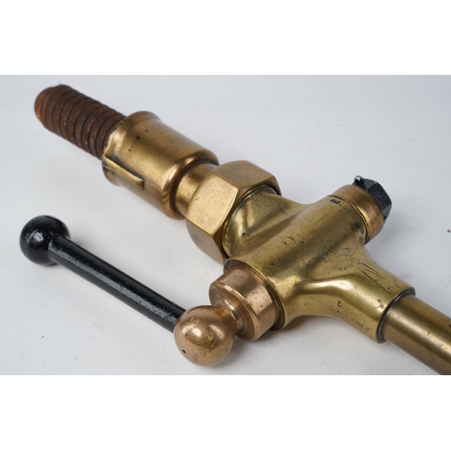 644 - An antique brass petrol pump nozzle.