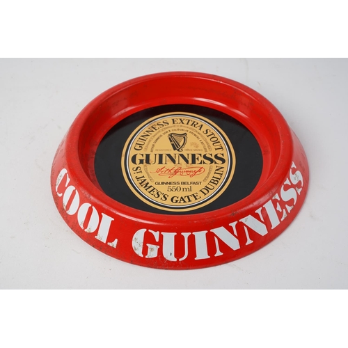 645 - A vintage Guinness metal ashtray.