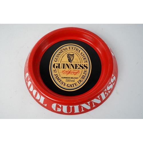 645 - A vintage Guinness metal ashtray.