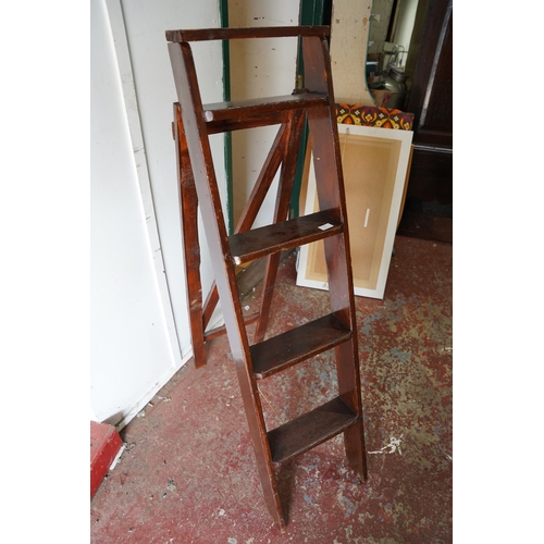 91 - A folding stepladder.