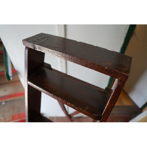 91 - A folding stepladder.