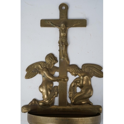 642 - A Religious brass wall mounted font.