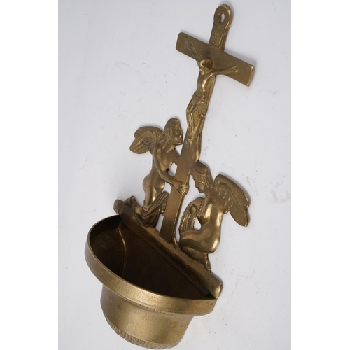 642 - A Religious brass wall mounted font.