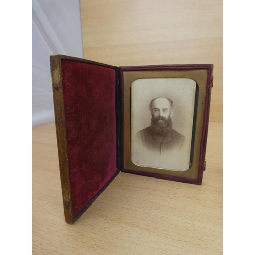 25 - Two antique picture frames and a paperweight.