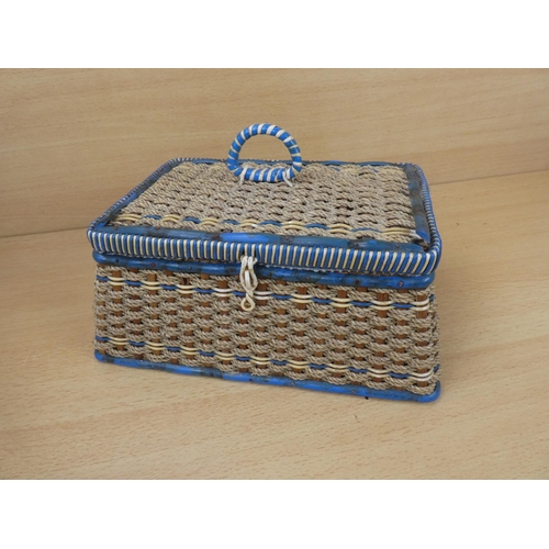 28 - A vintage sewing basket and contents.