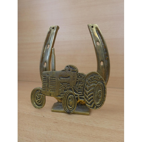 34 - A large brass horseshoe and tractor letter holder.