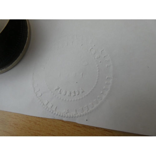 45 - An embossed stamper.