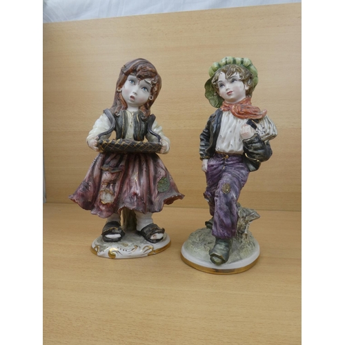 72 - A pair of Capodimonte style figures, each measuring 30cm in height.