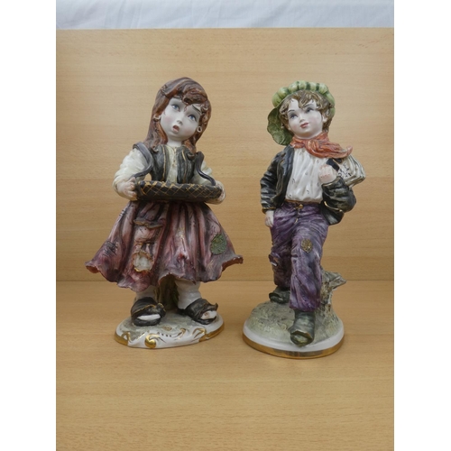 72 - A pair of Capodimonte style figures, each measuring 30cm in height.