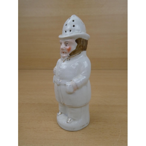 114 - An antique Staffordshire sugar shaker modelled as a police man.