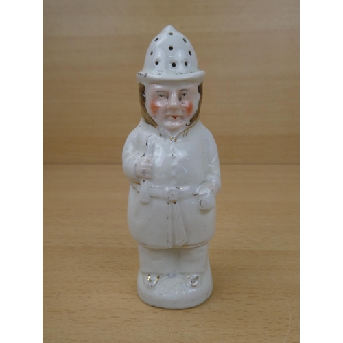 114 - An antique Staffordshire sugar shaker modelled as a police man.