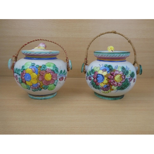 115 - A pair of Italian pottery lidded urns.