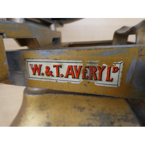 135 - A vintage set of W & T Avery Ltd shop scales and weights.