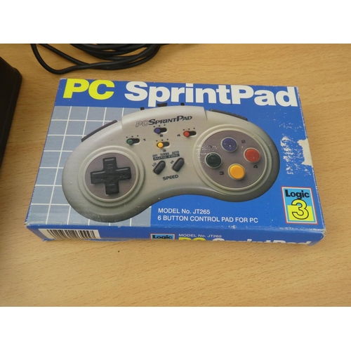 157 - A vintage boxed PC SprintPad Logic 3 control pad and a Logic 3 foot pedal.